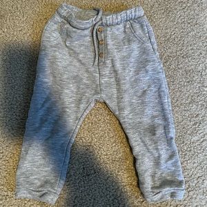 Grey sweatpants with button detail